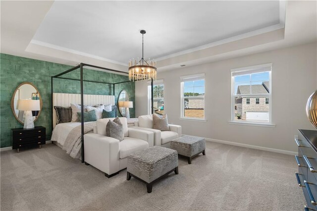 209 Chiswick Loop, Stockbridge, GA 30281 - carpeted bedroom with a raised ceiling, a chandelier, and crown molding