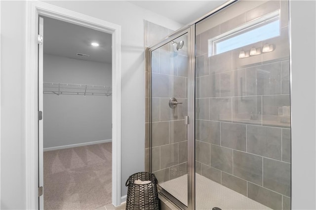 209 Chiswick Loop, Stockbridge, GA 30281 - bathroom featuring a stall shower and a spacious closet