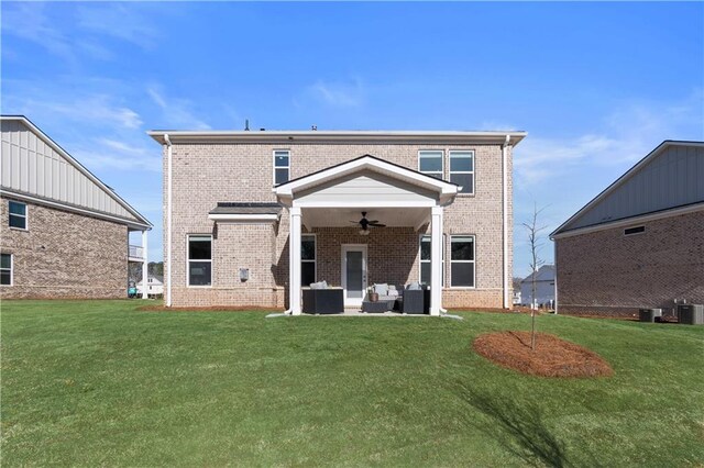 209 Chiswick Loop, Stockbridge, GA 30281 - rear view of property with ceiling fan, an outdoor living space, a lawn, and brick siding
