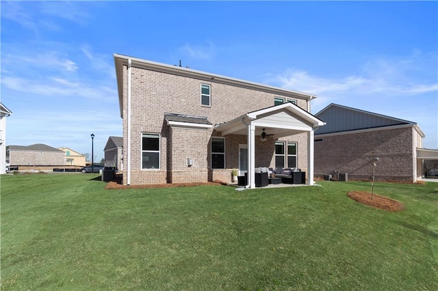 209 Chiswick Loop, Stockbridge, GA 30281 - rear view of house featuring an outdoor living space, a ceiling fan, brick siding, a yard, and a patio