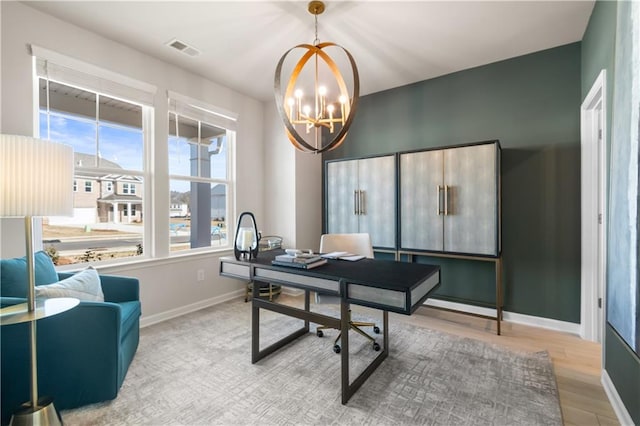 209 Chiswick Loop, Stockbridge, GA 30281 - office area with a chandelier and wood finished floors