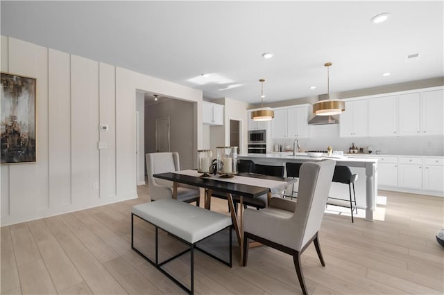 209 Chiswick Loop, Stockbridge, GA 30281 - dining room featuring light wood finished floors and recessed lighting