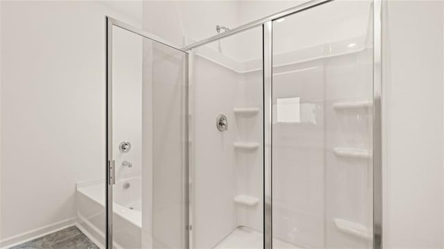 bathroom with tile patterned flooring and plus walk in shower