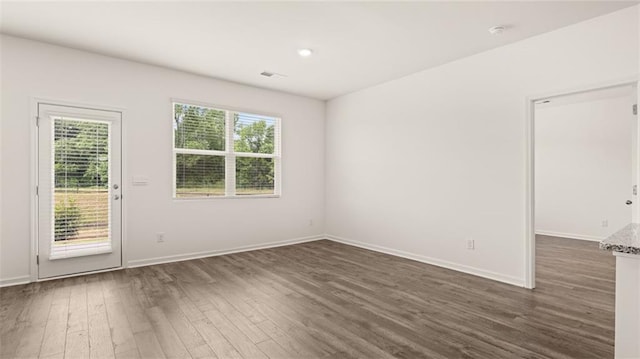 empty room featuring dark hardwood / wood-style floors