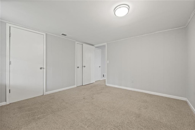 unfurnished bedroom featuring visible vents and carpet floors