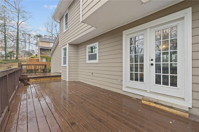 wooden deck featuring french doors