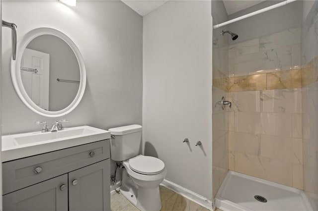 full bath featuring vanity, toilet, and a stall shower