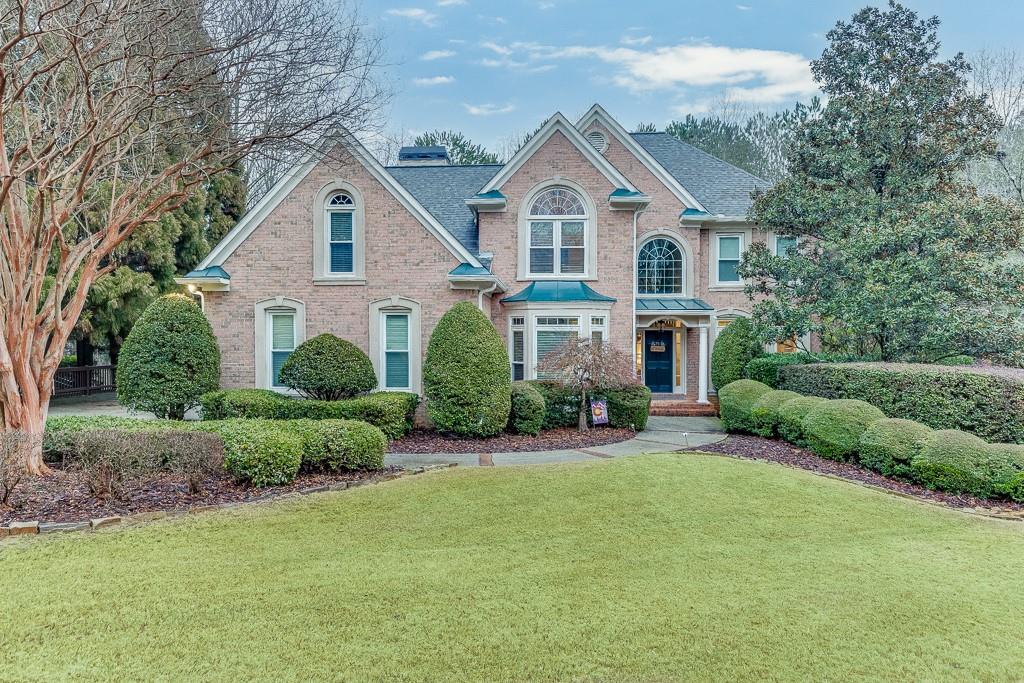 view of property featuring a front yard