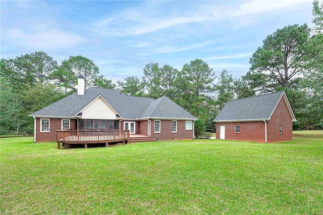 view of front of house featuring a deck and a front lawn