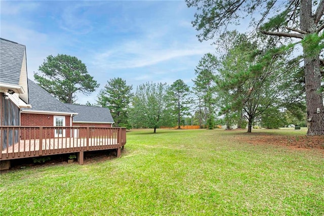 view of yard with a wooden deck