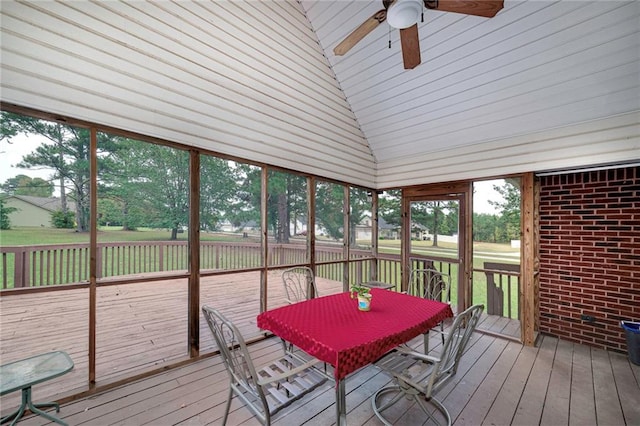 sunroom featuring plenty of natural light, ceiling fan, and vaulted ceiling