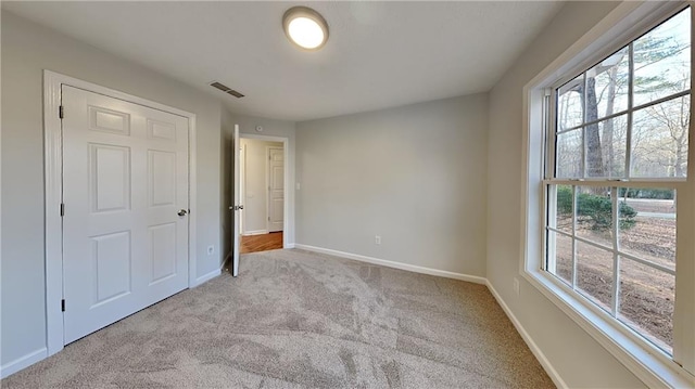 unfurnished bedroom with light carpet