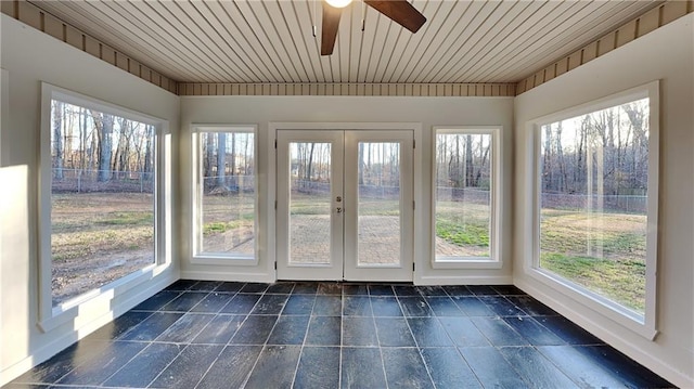 unfurnished sunroom with french doors, wooden ceiling, and a wealth of natural light