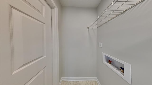 clothes washing area featuring washer hookup