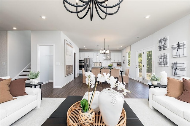 608 Belshire Dr, Acworth, GA 30102 - living area featuring a chandelier, recessed lighting, dark wood-type flooring, stairs, and french doors
