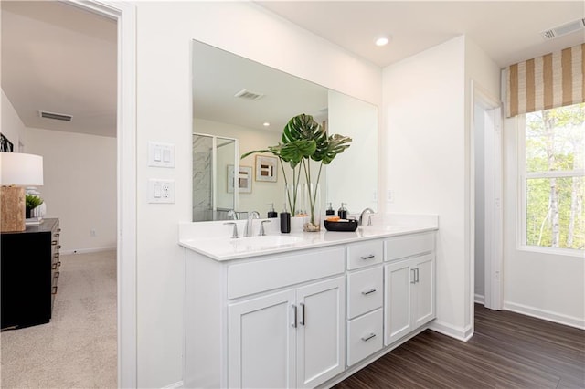 608 Belshire Dr, Acworth, GA 30102 - bathroom with double vanity, a shower, wood finished floors, and recessed lighting