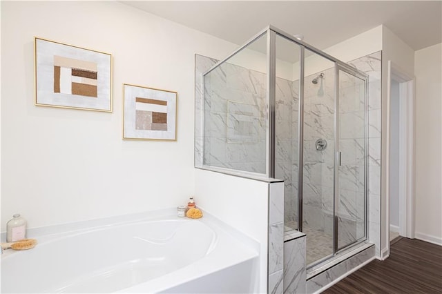 608 Belshire Dr, Acworth, GA 30102 - bathroom with a bath, a marble finish shower, and wood finished floors