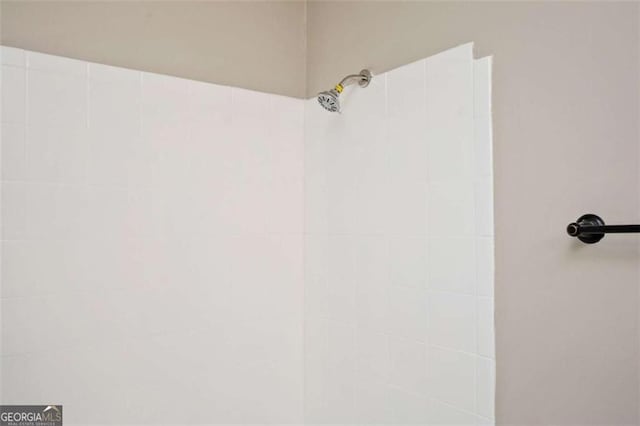 bathroom view of tiled shower