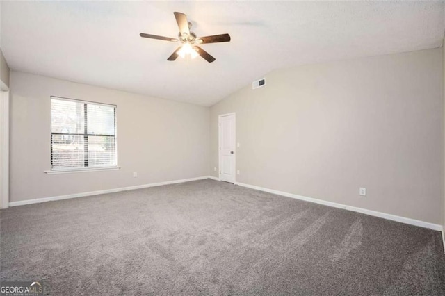 carpeted empty room with ceiling fan, baseboards, and lofted ceiling