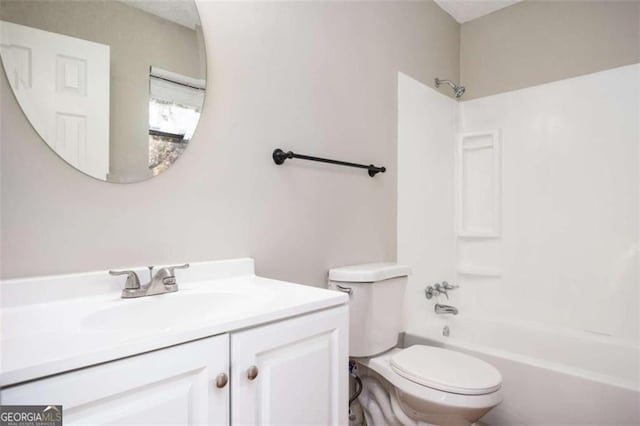 full bath featuring toilet, vanity, and  shower combination