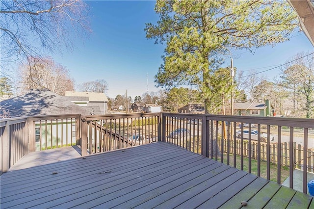 wooden deck featuring a residential view