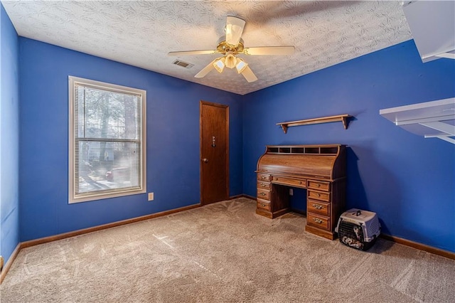 office area with visible vents, carpet flooring, ceiling fan, a textured ceiling, and baseboards