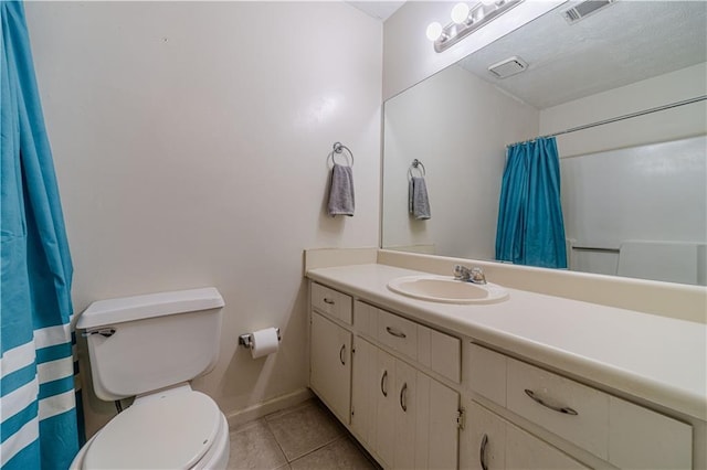 bathroom featuring tile patterned flooring, toilet, a shower with shower curtain, vanity, and visible vents