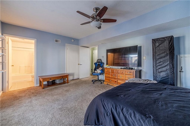 bedroom with a ceiling fan, carpet, visible vents, and a textured ceiling