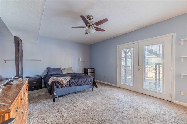 carpeted bedroom featuring baseboards, ceiling fan, access to outside, a textured ceiling, and french doors