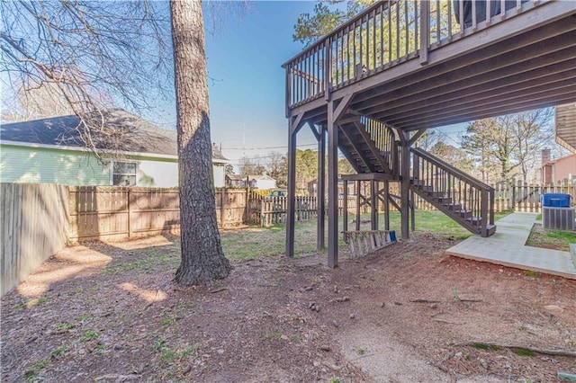 view of yard with a fenced backyard, stairway, a patio, and a wooden deck