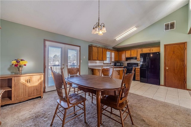 dining area with light tile patterned floors, visible vents, light colored carpet, an inviting chandelier, and french doors