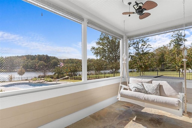 sunroom featuring ceiling fan