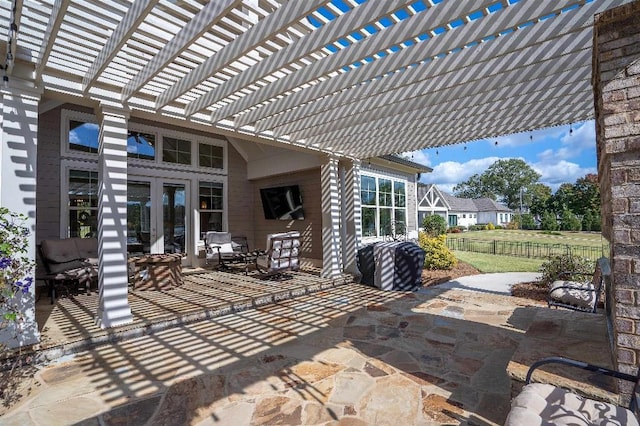 view of patio featuring a pergola and french doors