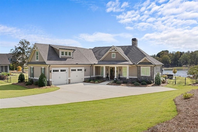 craftsman-style home featuring a front lawn and a water view