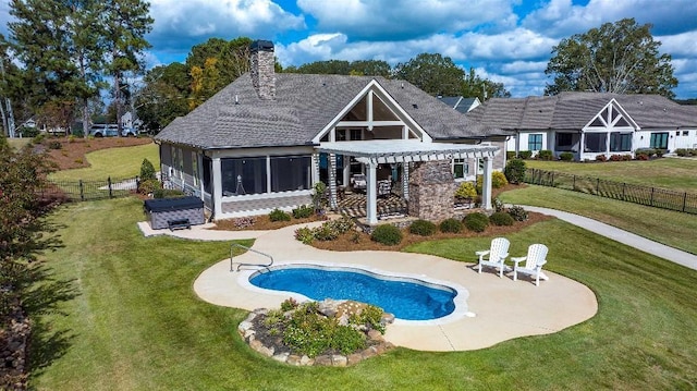 back of house with a sunroom, a fenced in pool, a patio, a yard, and a pergola