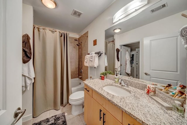 full bathroom featuring vanity, toilet, tile patterned flooring, and shower / bath combo