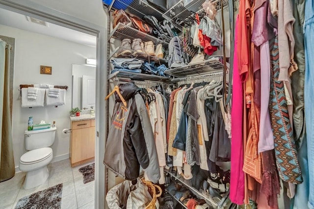 walk in closet featuring light tile patterned floors