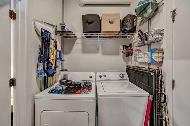 laundry room featuring washing machine and dryer