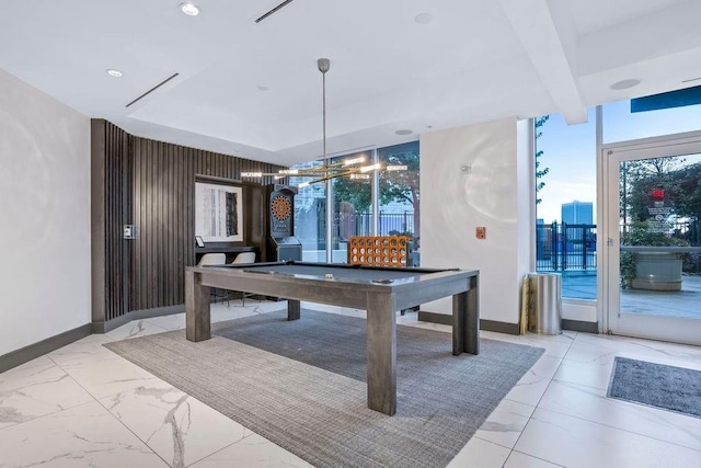 rec room featuring pool table and a notable chandelier