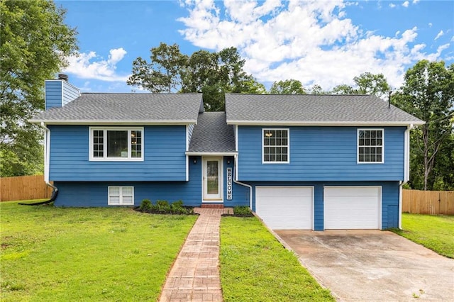 319 Hill Crest Cir, Woodstock, GA 30188 - raised ranch with an attached garage, driveway, and a chimney