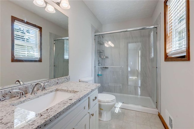 319 Hill Crest Cir, Woodstock, GA 30188 - full bathroom featuring toilet, vanity, a shower stall, marble look tile flooring, and a textured ceiling