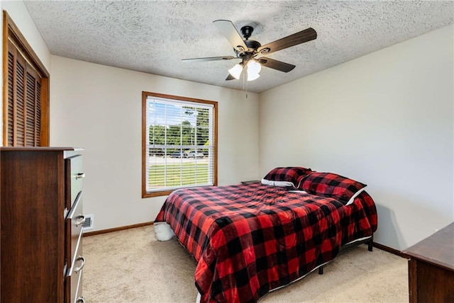 319 Hill Crest Cir, Woodstock, GA 30188 - bedroom with light colored carpet, baseboards, a ceiling fan, and a textured ceiling