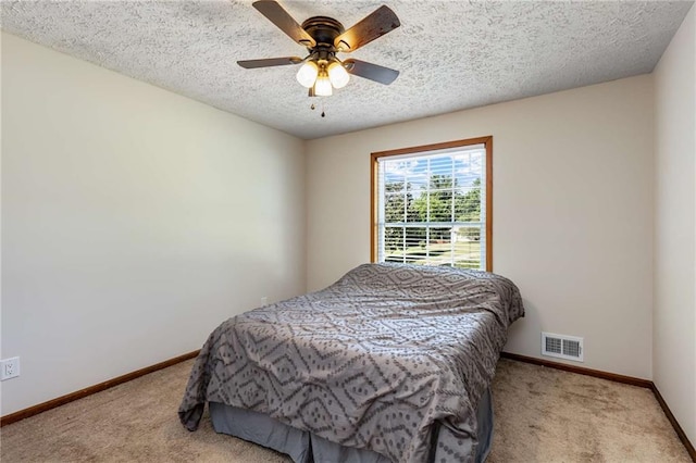 319 Hill Crest Cir, Woodstock, GA 30188 - bedroom with carpet floors, baseboards, a textured ceiling, and a ceiling fan