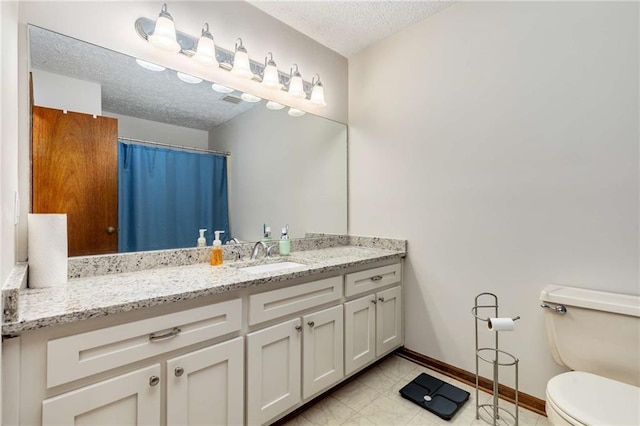 319 Hill Crest Cir, Woodstock, GA 30188 - bathroom with vanity, toilet, a textured ceiling, baseboards, and a shower with shower curtain