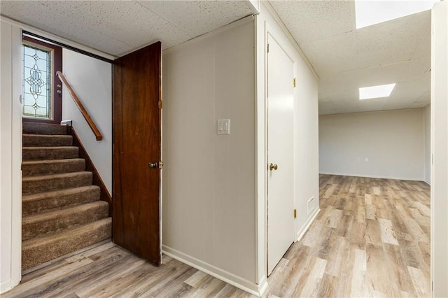 319 Hill Crest Cir, Woodstock, GA 30188 - corridor with a drop ceiling, light wood-style floors, stairway, and baseboards