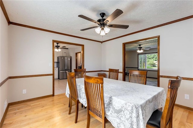 319 Hill Crest Cir, Woodstock, GA 30188 - dining space with light wood-style flooring, ceiling fan, a textured ceiling, baseboards, and ornamental molding