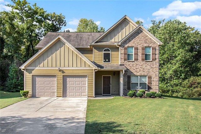 craftsman-style home with a front yard and a garage