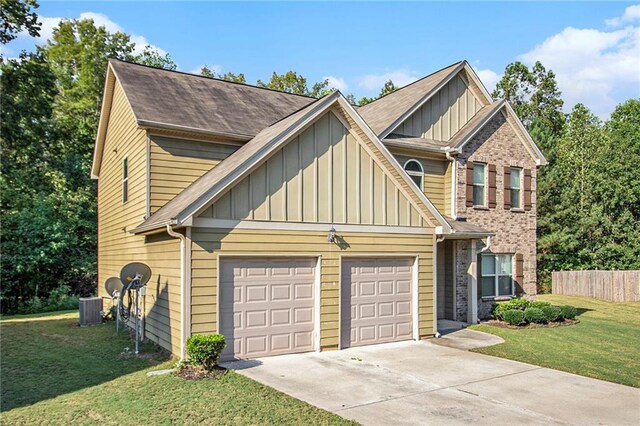 craftsman house with a garage, a front yard, and central AC