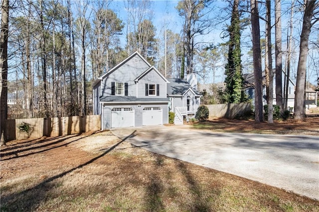 view of side of property with a garage