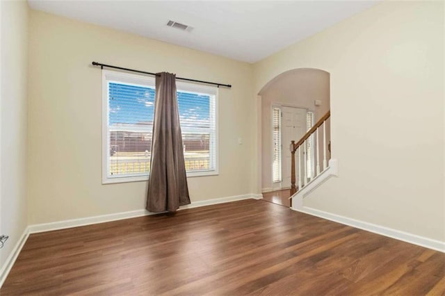 spare room featuring dark hardwood / wood-style floors